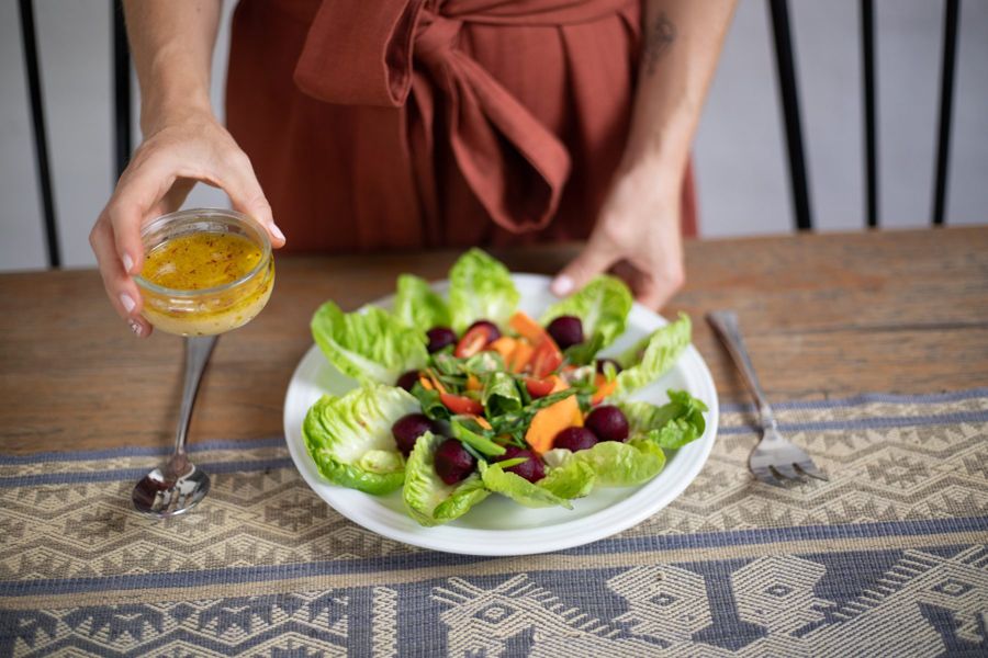 A bright salad with beets and carrots on a wooden table